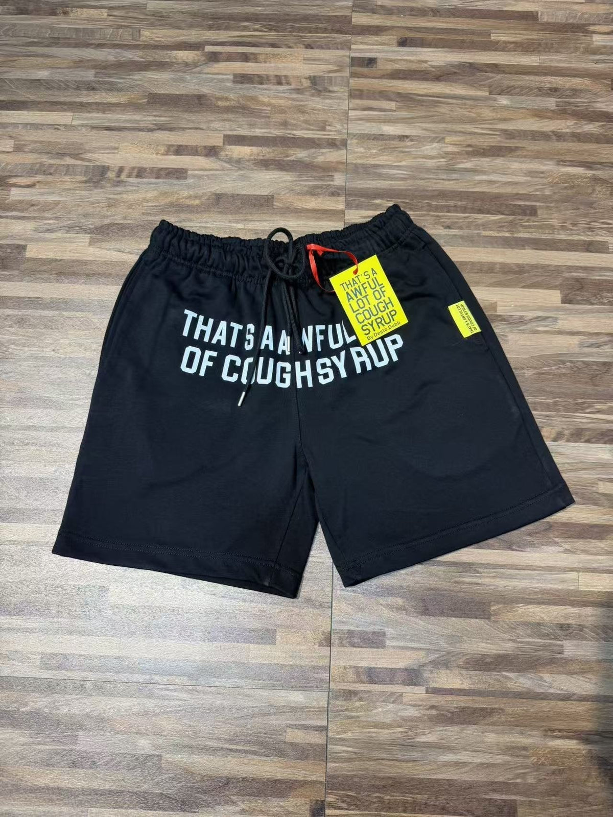 THAT'S A AWFUL LOT OF COUGH SYRUP Black Graphic Shorts