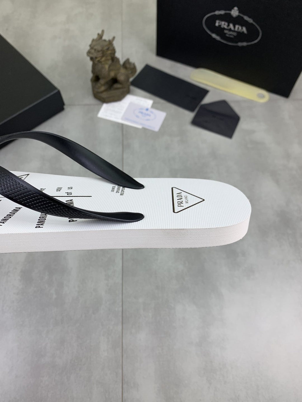 Prada Black Strap White Flip Flops